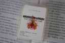 wax melt packaging for the scent 'enemies to lovers' displayed on an open book background