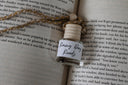 car diffuser small glass jar with wooden lid and string for the scent 'rainy day reads'