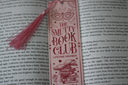 handmade bookmark in pink with cute illustrations and text that reads 'the smutty book club lifetime member'