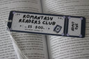 Bookmark shaped to look like a movie ticket. Text reads 'romantasy readers club'