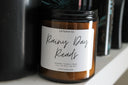 amber candle jar displaying the label that reads 'rainy day reads'