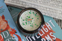 Santa baby slip me a fictional man candle with festive green sprinkles and wooden wick 