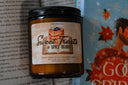 'Sweet Treats & Spicy Reads' romantasy book-themed candle on a book background