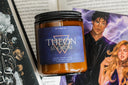 Candle with 'Theon' label on romance illustration